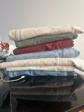 Stack of Folded fee people jeans. new and used once Jeans